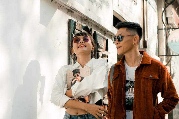 Woman confidently wearing bespoke citrus-amber signature scent, Luxury unboxing experience of limited-edition fragrance.