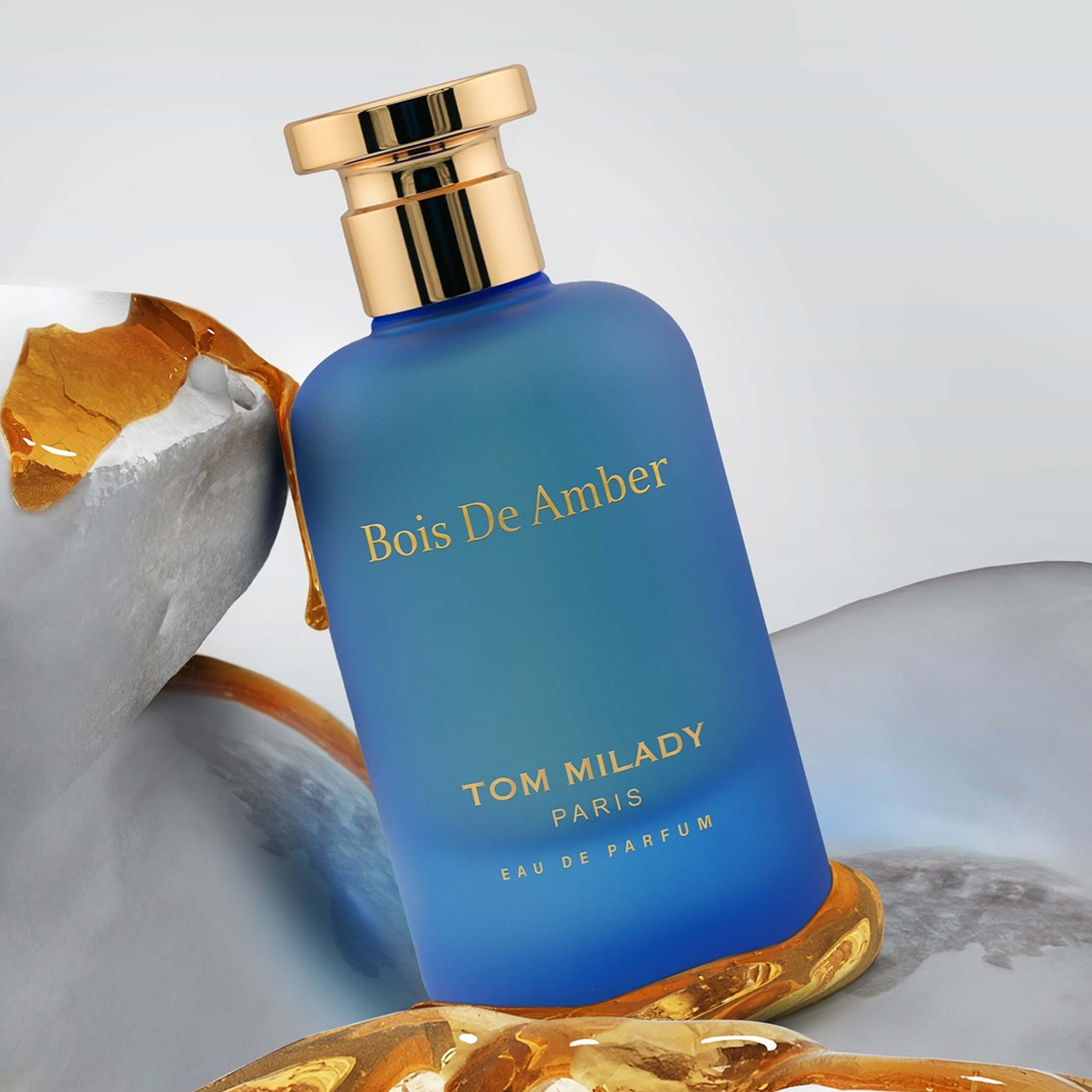 Woman confidently wearing bespoke citrus-amber signature scent, Luxury unboxing experience of limited-edition fragrance.