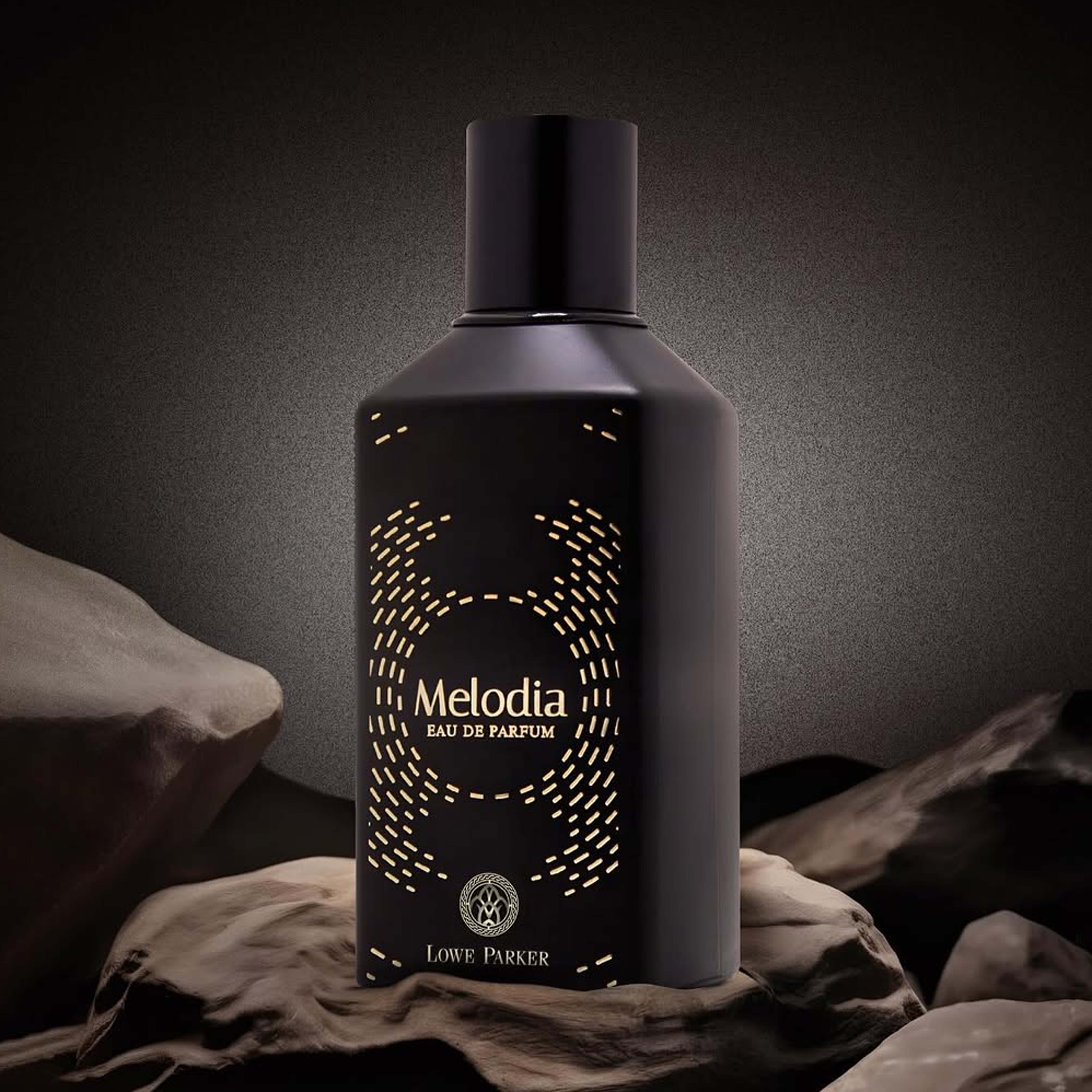 Woman confidently wearing bespoke citrus-amber signature scent, Luxury unboxing experience of limited-edition fragrance.