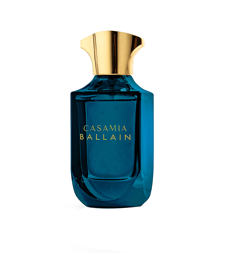 Woman confidently wearing bespoke citrus-amber signature scent, Luxury unboxing experience of limited-edition fragrance.